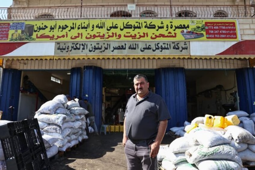 Palestinian-American entrepreneur Jamal Zaglul, in front of his olive press in Turmus Aya,