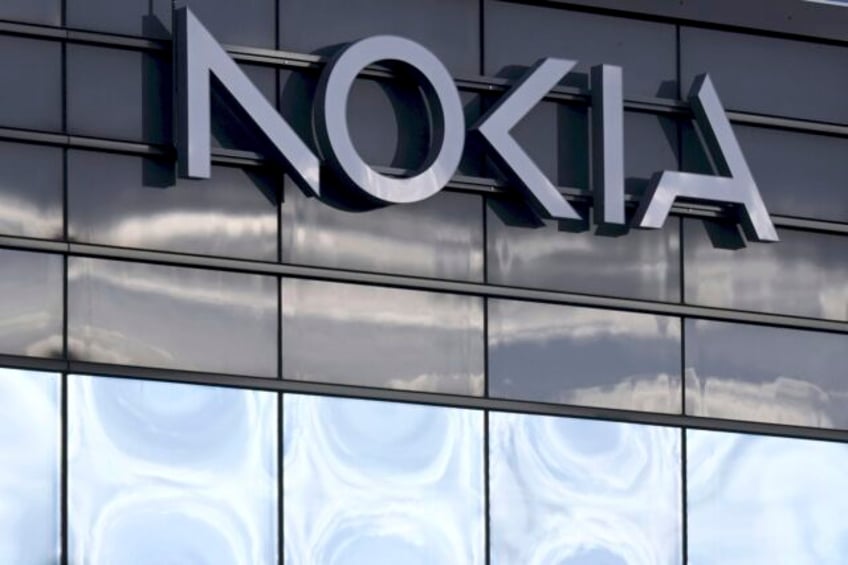 nokia plans to cut up to 14000 jobs after sales and profits plunge in a weak market