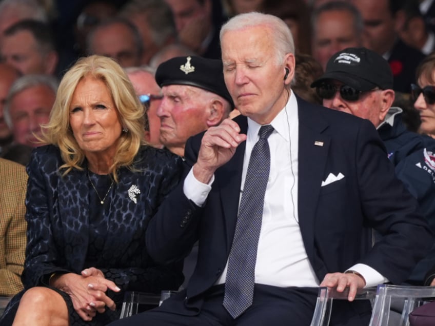 US President Joe Biden and US First Lady Jill Biden at the 80th D-Day anniversary international commemoration on Omaha beach in Normandy, France, on Thursday, June 6, 2024. President Joe Biden is in France to commemorate the 80th anniversary of the D-Day landings at Normandy during World War II, with a series of events designed to serve as symbolic rebukes of leaders the US president has painted as looming dangers. Photographer: Nathan Laine/Bloomberg via Getty Images