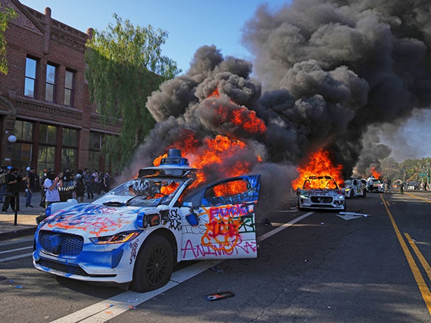 Multiple Waymo taxis burn near the Metropolitan Detention Center of downtown Los Angeles,