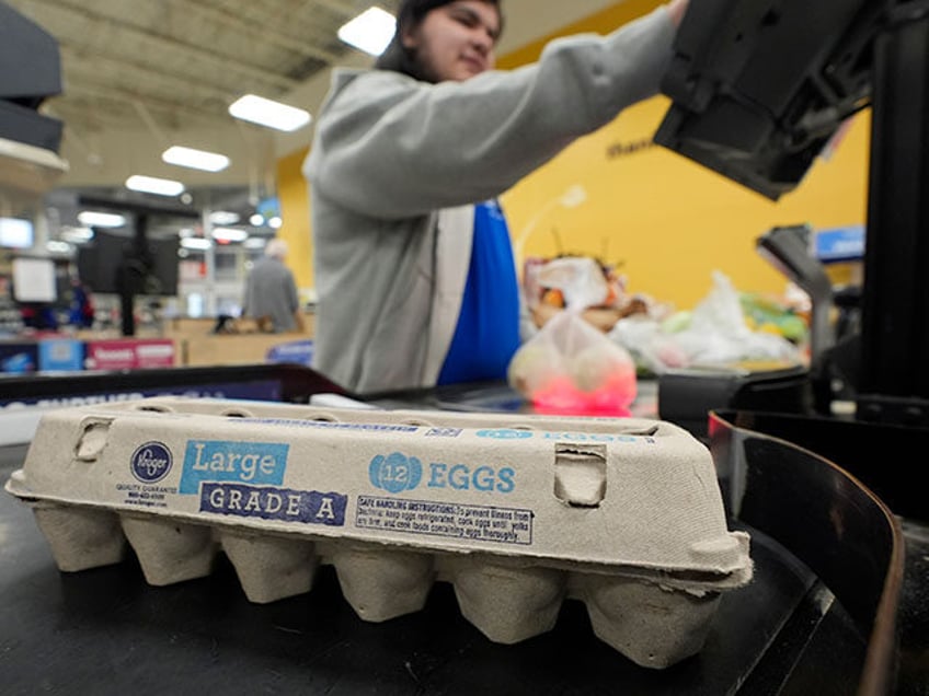 Cashier Josh Jimenez rings up egg for sale at a grocery store on Friday, Feb. 7, 2025, in