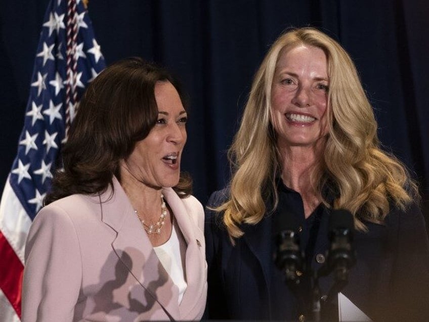 Vice President Kamala Harris, left, is greeted by Laurene Powell Jobs, founder and chair o