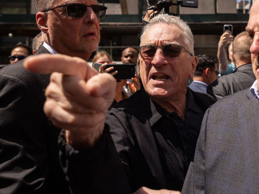 Actor Robert De Niro, center, points to a supporter of former US President Donald Trump, n