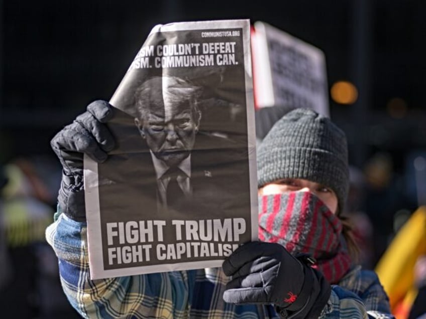 CHICAGO, ILLINOIS, UNITED STATES - JANUARY 20: Protesters march through downtown Chicago,