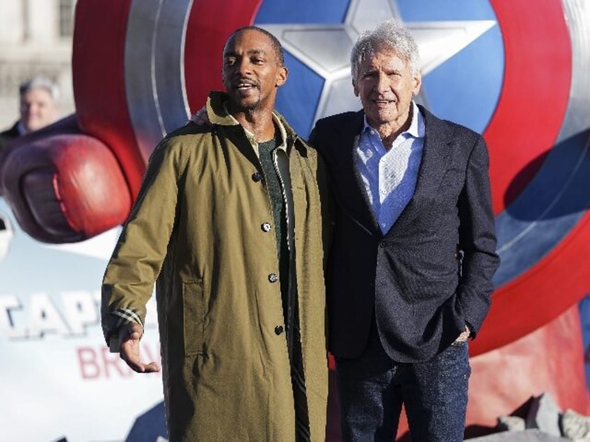 Anthony Mackie, left, and Harrison Ford pose for photographers at the photo call for the f