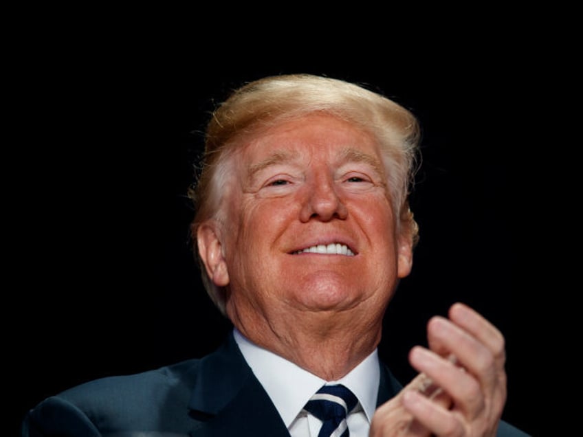 President Donald Trump smiles during the National Prayer Breakfast, Thursday, Feb. 8, 2018