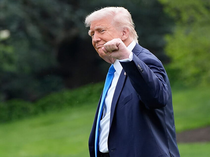 President Donald Trump gestures as he walks from the Oval Office to depart on Marine One f