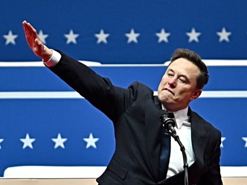 Tesla and SpaceX CEO Elon Musk gestures as he speaks during the inaugural parade inside Ca