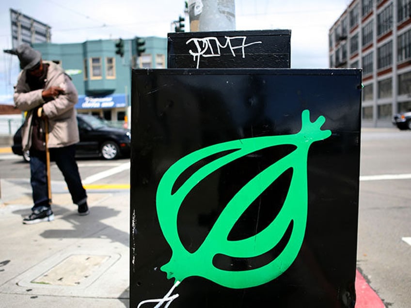 A pedestrian walks by an Onion news rack May 5, 2009 in San Francisco, California. Satiric