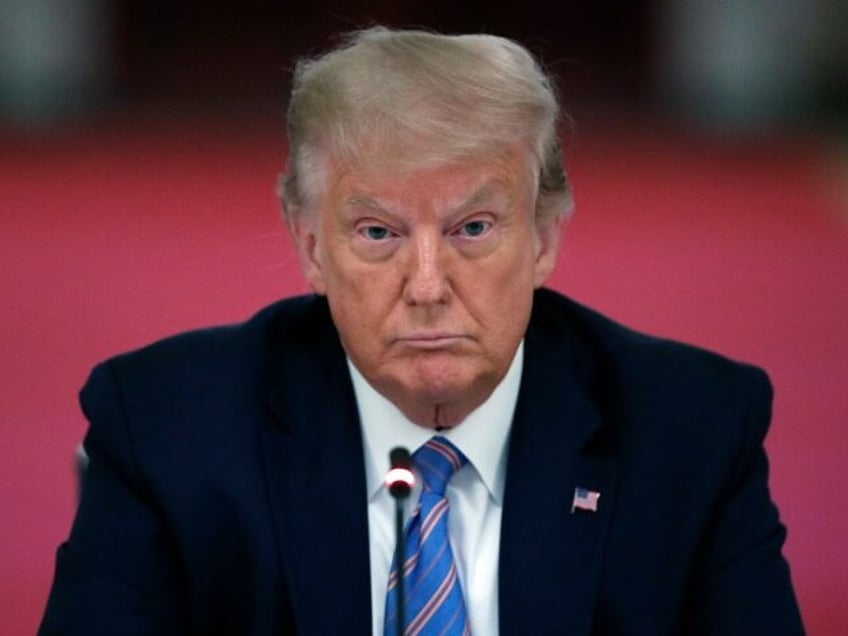 FILE - President Donald Trump listens during a "National Dialogue on Safely Reopening America's Schools," event in the East Room of the White House, on July 7, 2020, in Washington. A federal judge has rejected former President Donald Trump’s request to block the release of documents to the House committee …