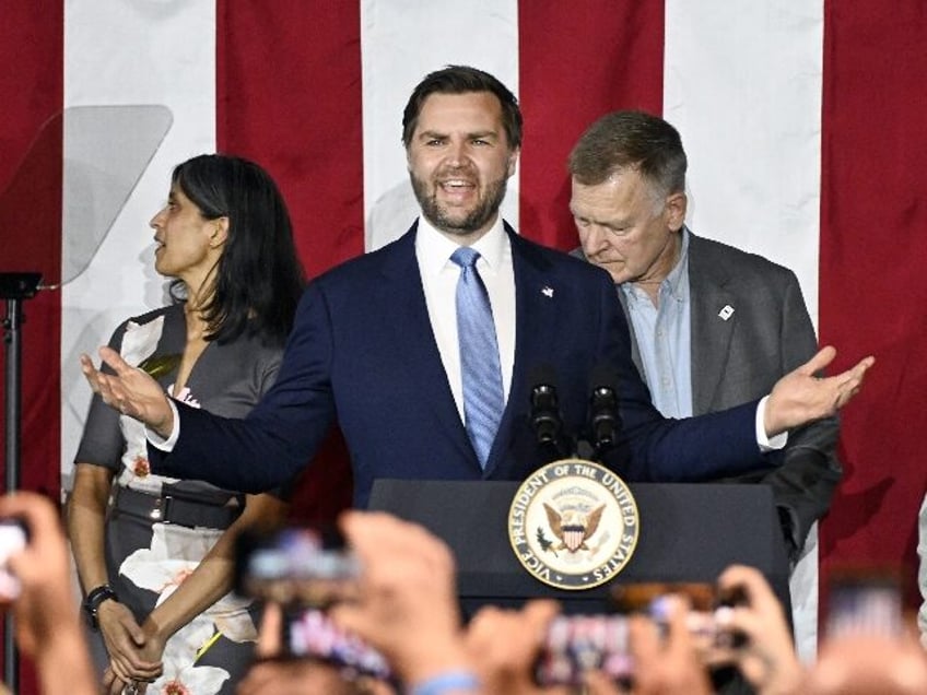 Vice President JD Vance, center, speaks at a rally about "America's industrial resurgence,