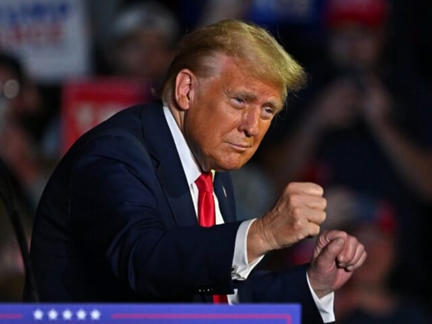 GREENVILLE, NC - OCTOBER 21: Republican presidential candidate Donald Trump dances for his