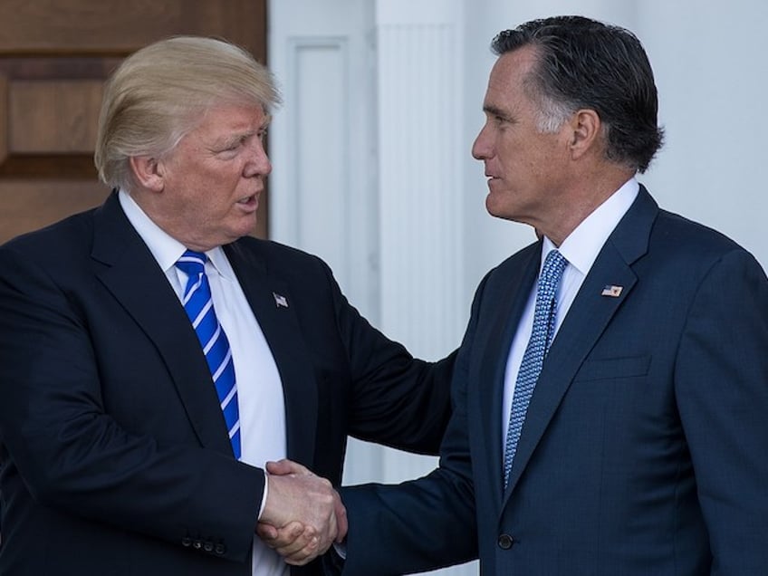 Then President-elect Donald Trump shakes hands with Senator Mitt Romney after their meeting at Trump International Golf Club, November 19, 2016 in Bedminster Township, New Jersey. (Drew Angerer/Getty Images)