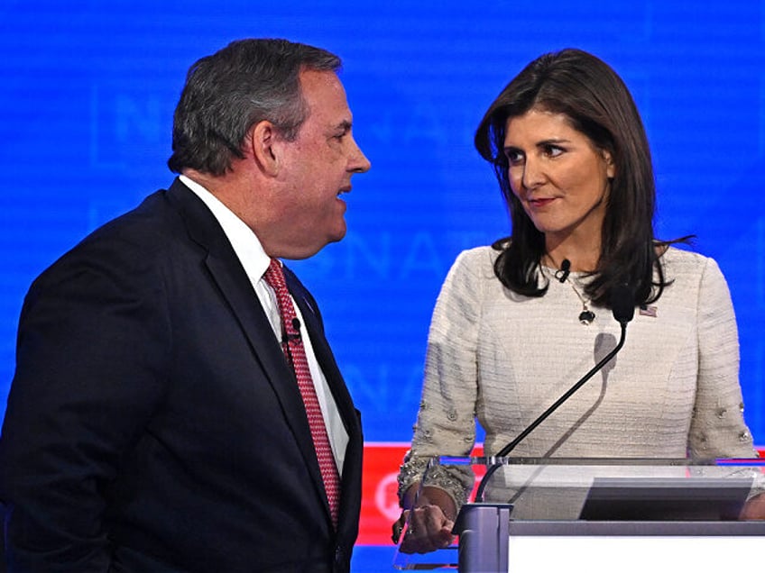 Former Governor of New Jersey Chris Christie (L) and former Governor from South Carolina and UN ambassador Nikki Haley speak during a break in the fourth Republican presidential primary debate at the University of Alabama in Tuscaloosa, Alabama, on December 6, 2023. (Photo by Jim WATSON / AFP) (Photo by …