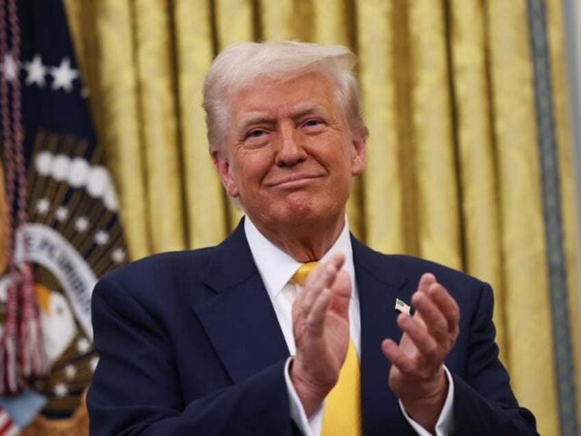 WASHINGTON, DC - FEBRUARY 21: U.S. President Donald Trump applauds after Howard Lutnick wa