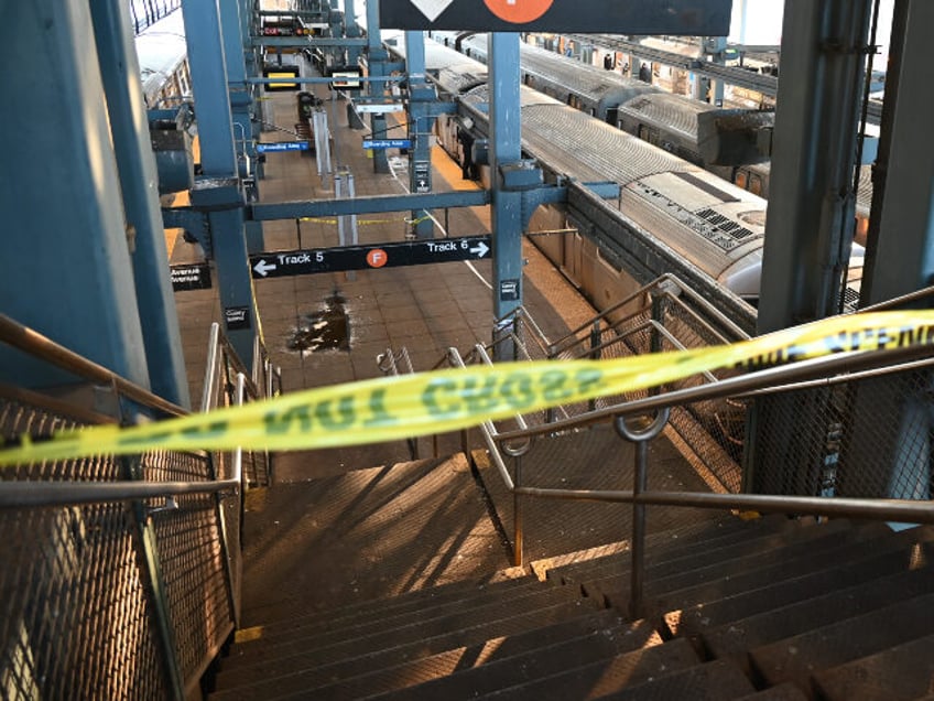 Police investigate at the Coney Island-Stillwell Avenue Station in Brooklyn after a woman