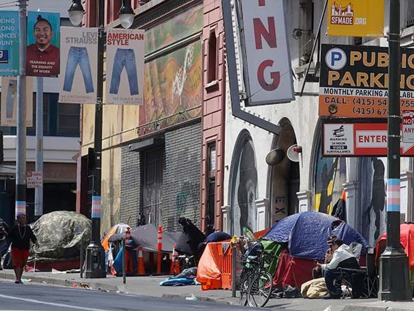 Tents line a sidewalk in the Tenderloin neighborhood of San Francisco on April 18, 2020. A