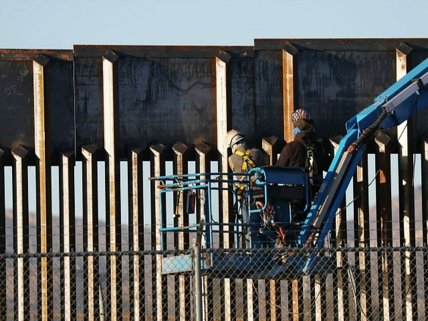 EL PASO, TEXAS - FEBRUARY 12: People work on the U.S./ Mexican border wall on February 12, 2019 in El Paso, Texas. U.S. President Donald Trump visited the border city yesterday as he continues to campaign for more wall to be built along the border. Democrats in Congress are asking for other additional border security measures. (Photo by Joe Raedle/Getty Images)