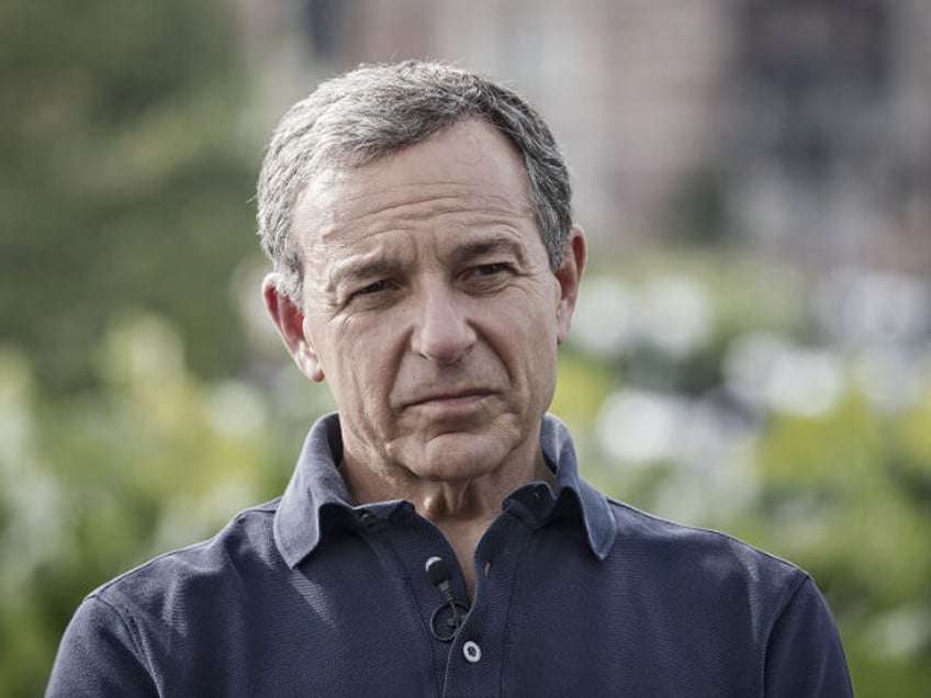 Bob Iger, chief executive officer of Walt Disney Co., listens during a Bloomberg Television interview at Disneyland in Shanghai, China, on Friday, June 16, 2017. Iger said he stepped down from Donald Trump's jobs panel two weeks ago following the president's decision to exit the Paris Accord on climate change …