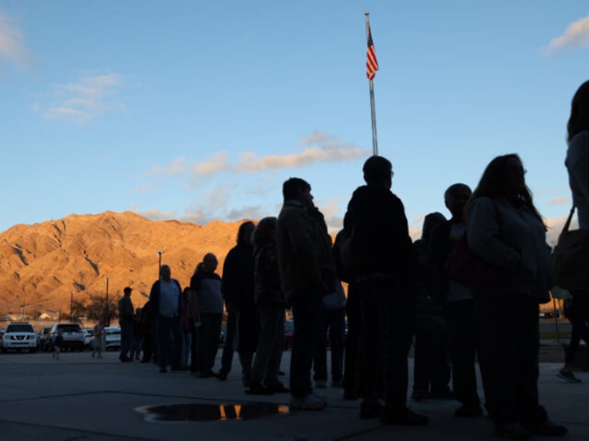 LAS VEGAS, USA - FEBRUARY 8: Voters wait in line outside the Hollywood Recreation Center b