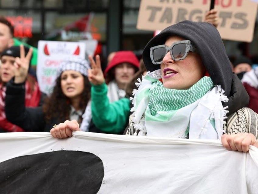 People participate in a protest during the march organized by Let Gaza Live on January 21, 2024 in Park City, Utah. The protest took place during day four of the Sundance Film Festival and shut down Park City’s Main Street. (Natasha Campos/Getty)