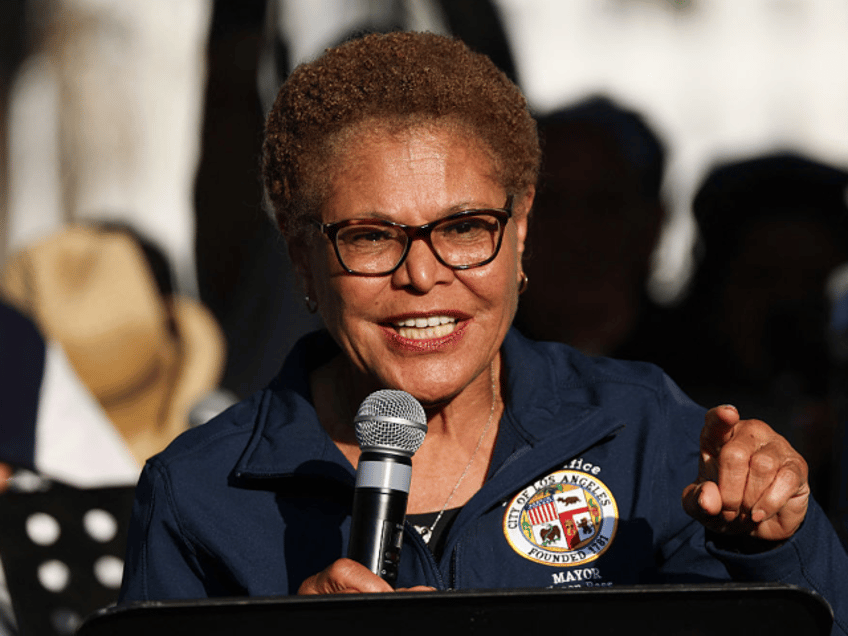 LA Mayor Karen Bass speaks at a prayer vigil in Grand Park as curfew goes in effect after