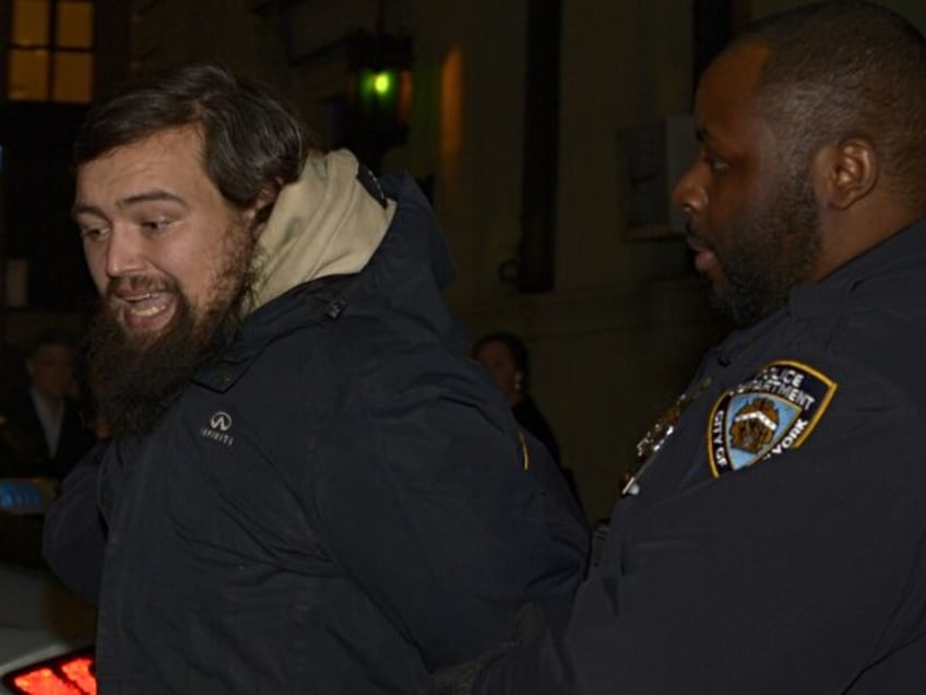 UNITED STATES -January 24: Taylor Swift's alleged stalker David Crowe is seen here on Wednesday, January 24, 2024, in the custody of police officers of NYPD's 1st precinct. (Photo by Sam Costanza for NY Daily News via Getty Images)