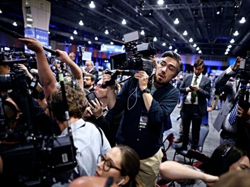 PHILADELPHIA, PENNSYLVANIA - SEPTEMBER 10: Journalists scramble to get a view of Republica