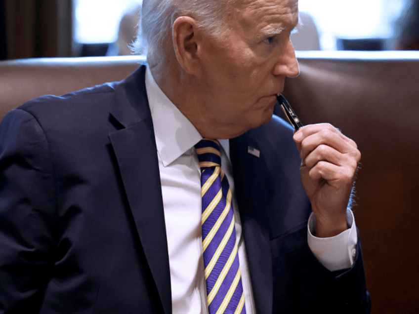 WASHINGTON, DC - SEPTEMBER 20: U.S. President Joe Biden listens to first lady Jill Biden s
