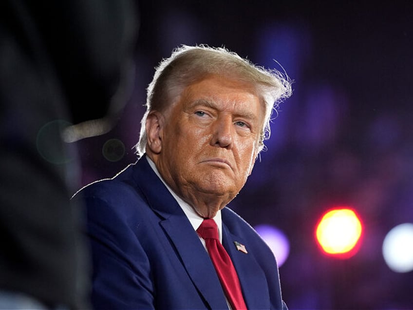 Republican presidential nominee former President Donald Trump listens at a town hall campa