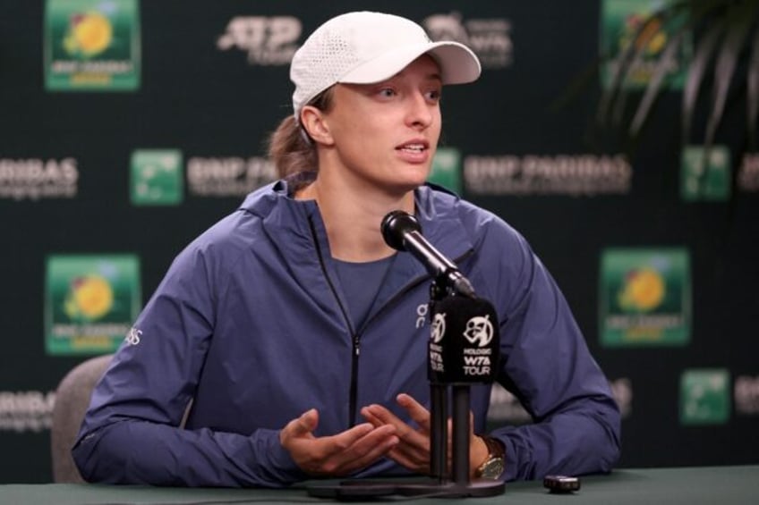 World number one Iga Swiatek of Poland fields questions from the media before the Indian W