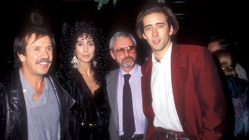 Sonny Bono, Cher, Norman Jewison, and Nicolas Cage posing together