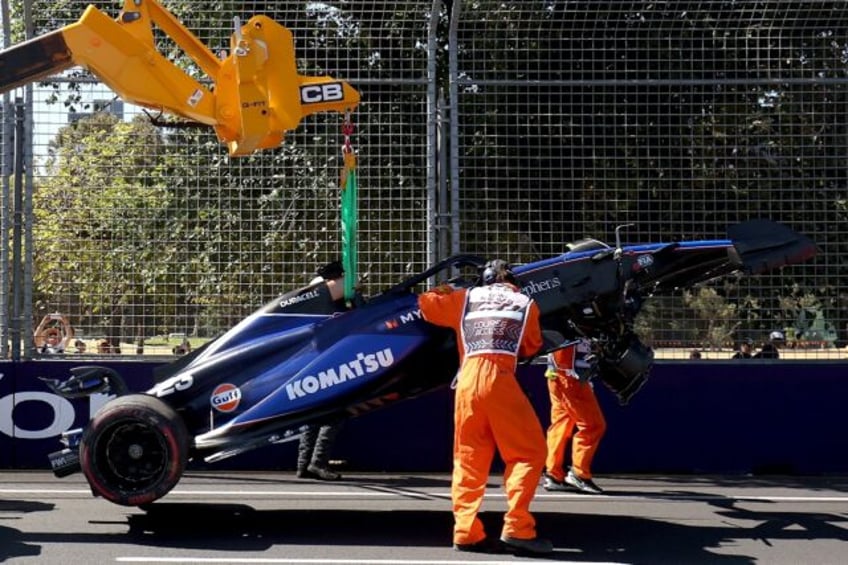 Marshals remove Williams' driver Alexander Albon crashed car from Albert Park circuit