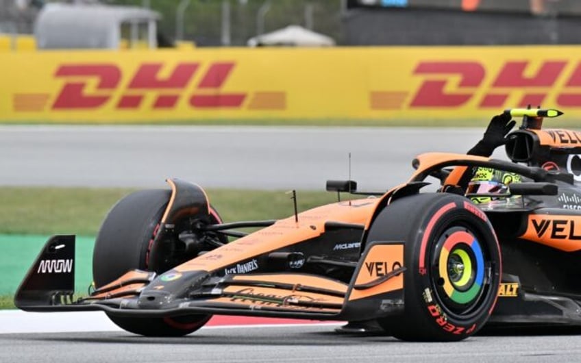 McLaren's Lando Norris celebrates pole in Spain
