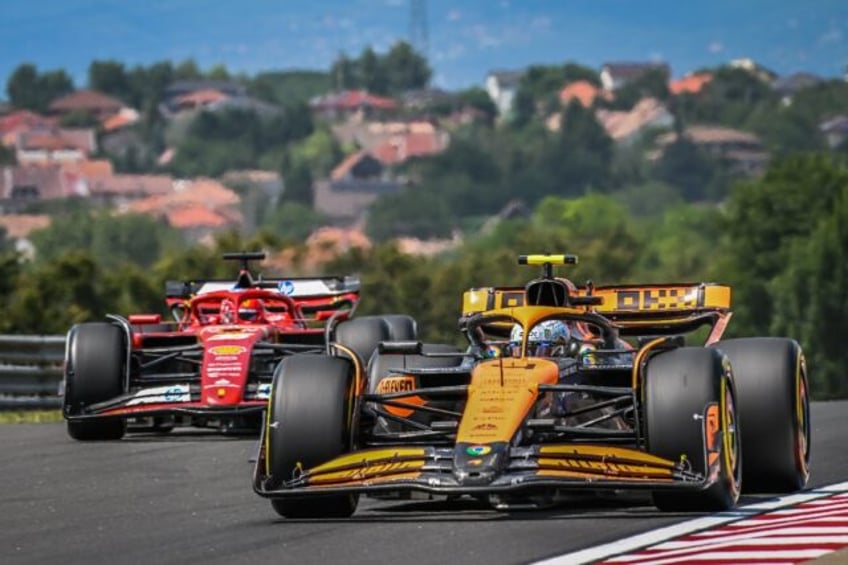 McLaren's British driver Lando Norris (R) at the Hungaroring race track in Mogyorod near B