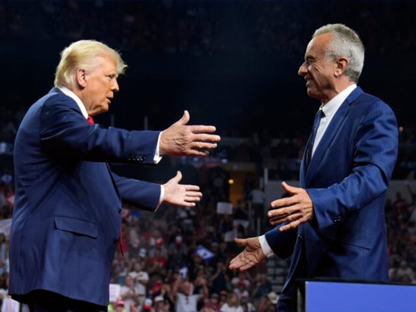 Republican presidential nominee former President Donald Trump greets Independent president