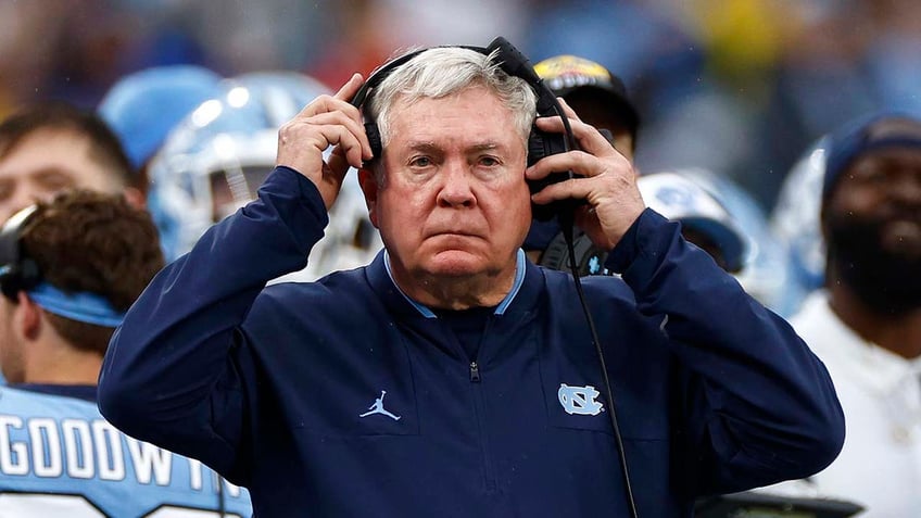 Mack Brown looks on during a game