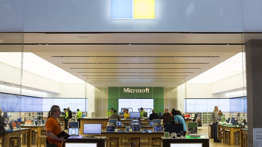 An employee waits to greet customers at a Microsoft Corp. store in Bellevue, Washington, U.S., on Thursday, Jan. 26, 2017.