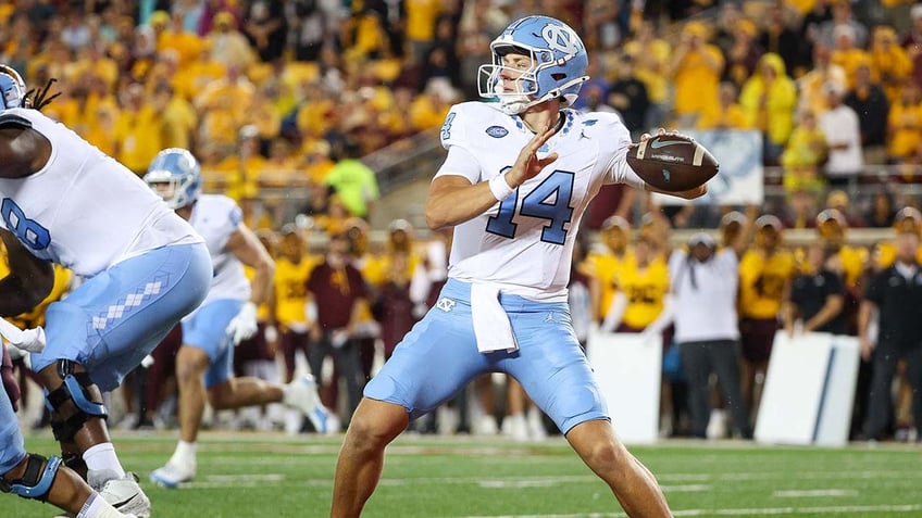 Max Johnson throws a football