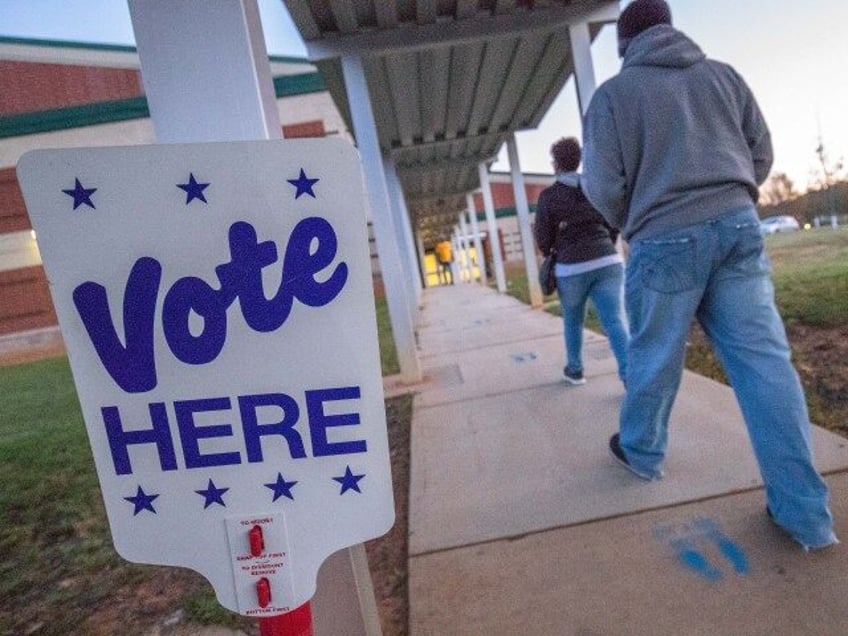 Voters arrive at Waddell Language Academy in Charlotte, North Carolina shortly after the p