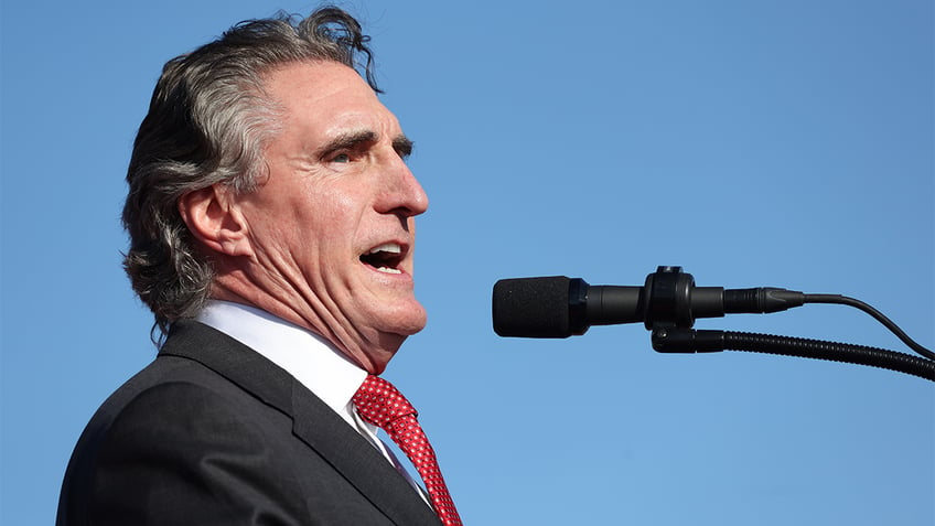 north dakota gov former presidential candidate doug burgum front and center at trump new jersey rally