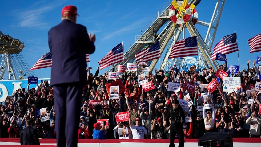 north dakota gov former presidential candidate doug burgum front and center at trump new jersey rally