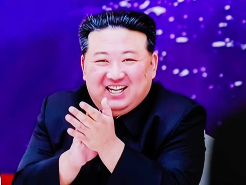 TV news at Seoul's Yongsan Railway Station shows North Korean leader Kim Jong Un (R) and his daughter (L), believed to be named Kim Ju Ae, attending a banquet to celebrate the country's successful launch of a reconnaissance satellite. North Korean leader Kim Jong-un has lauded the country's successful launch …