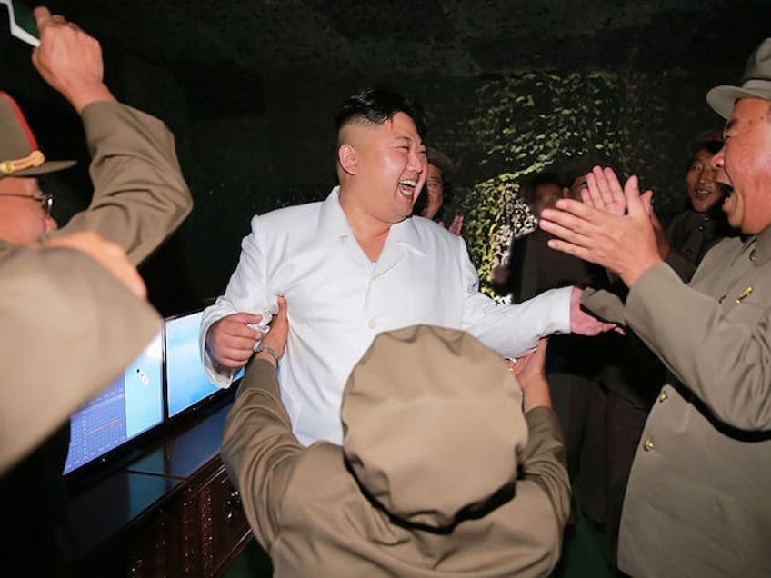 north korea kim jong un celebrates ballistic missile test with mass dancing