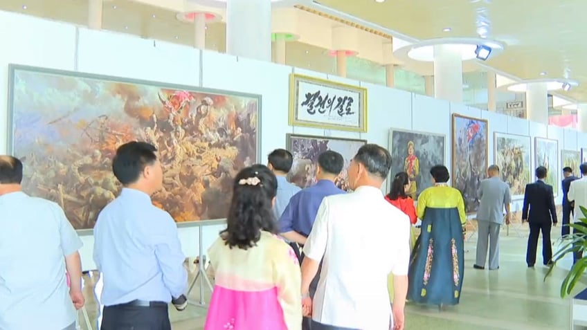 north korea opens exhibit celebrating romantic visions of kim jong un for anniversary