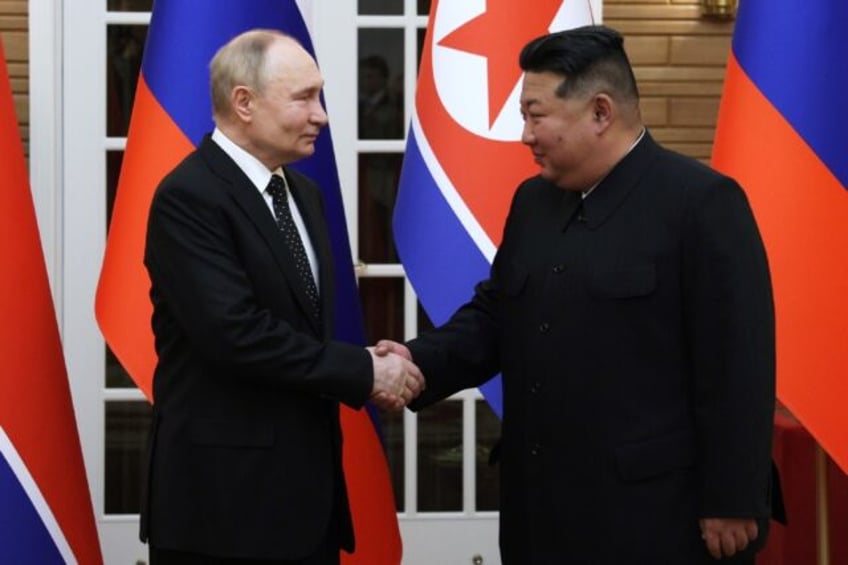 A defence pact agreed upon by Russian President Vladimir Putin (L) and North Korean leader