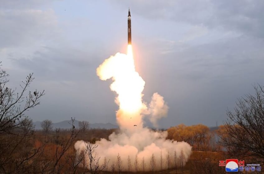 North Korea's official Korean Central News Agency shows the first test-fire of a new-type