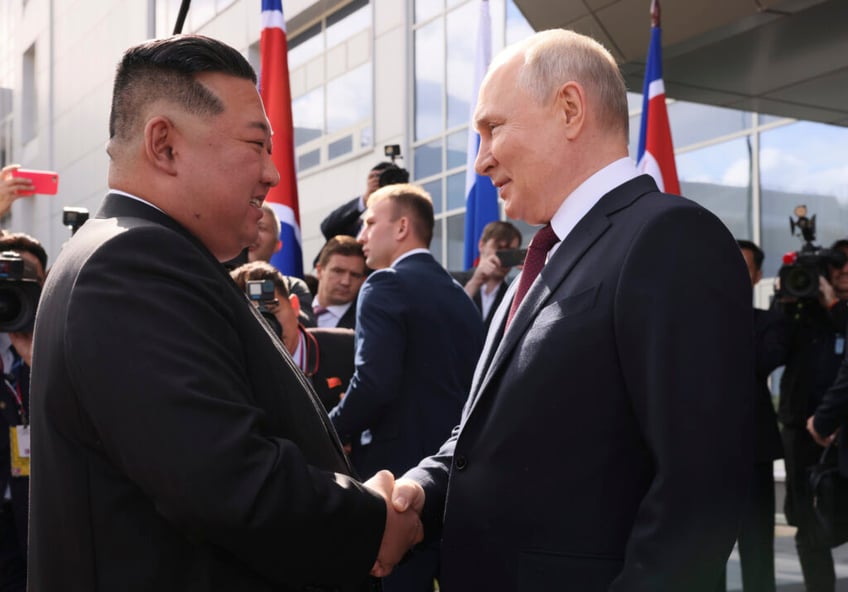 north koreas kim jong un meets vladimir putin praises heroic russian army at top space center