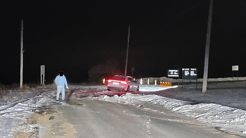 Snowy road, a person