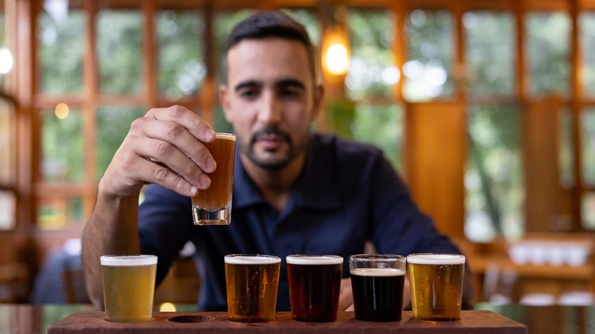 Man drinking beer in a flight